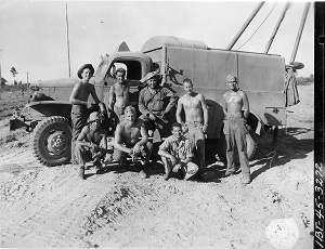 Group of Servicemen in front of truck